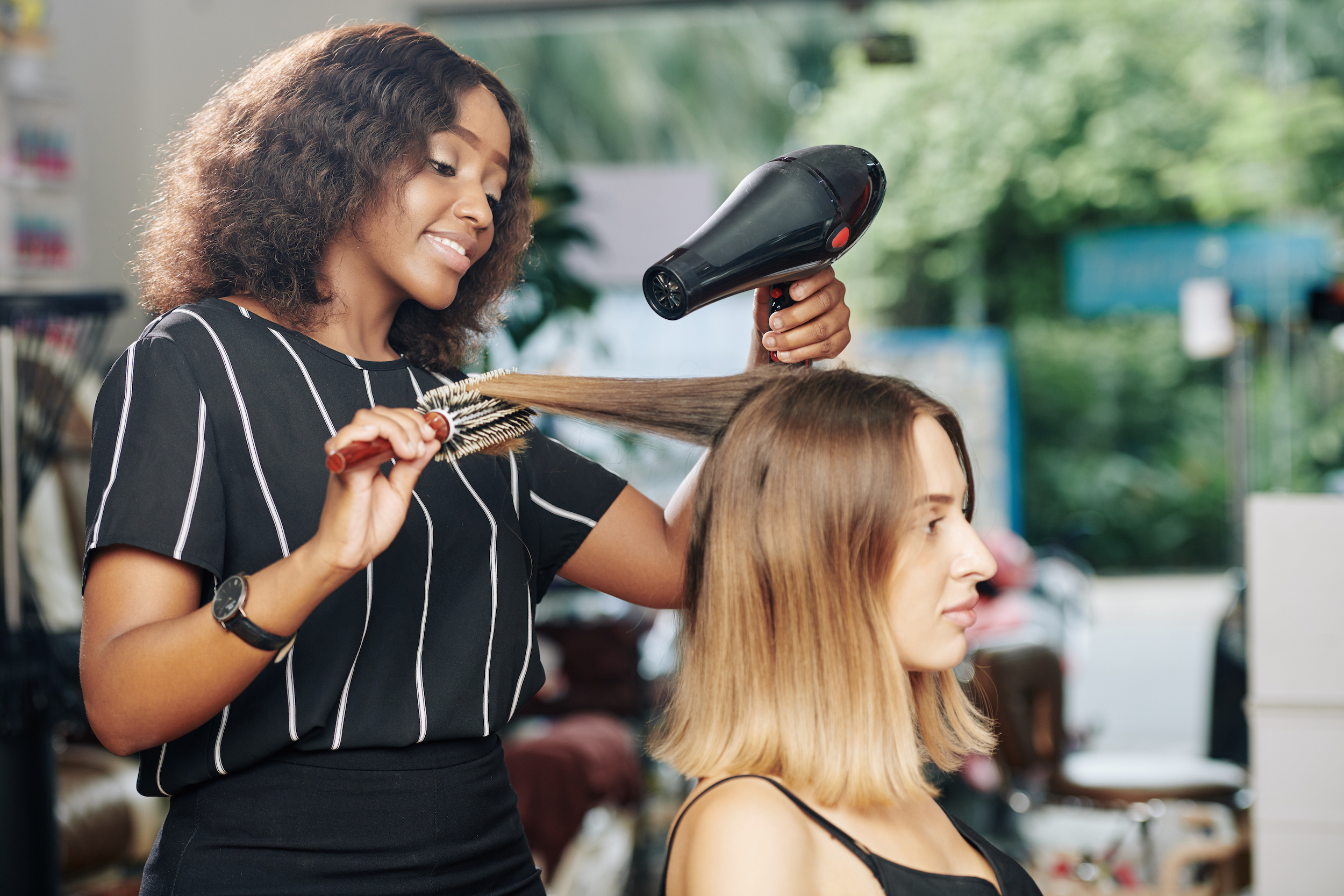 Woman getting her hair blow dried