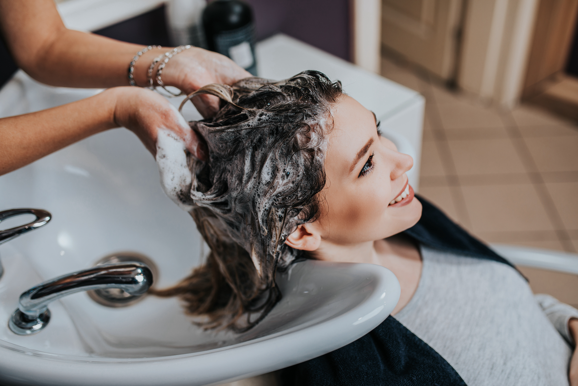 Woman getting her hair washed