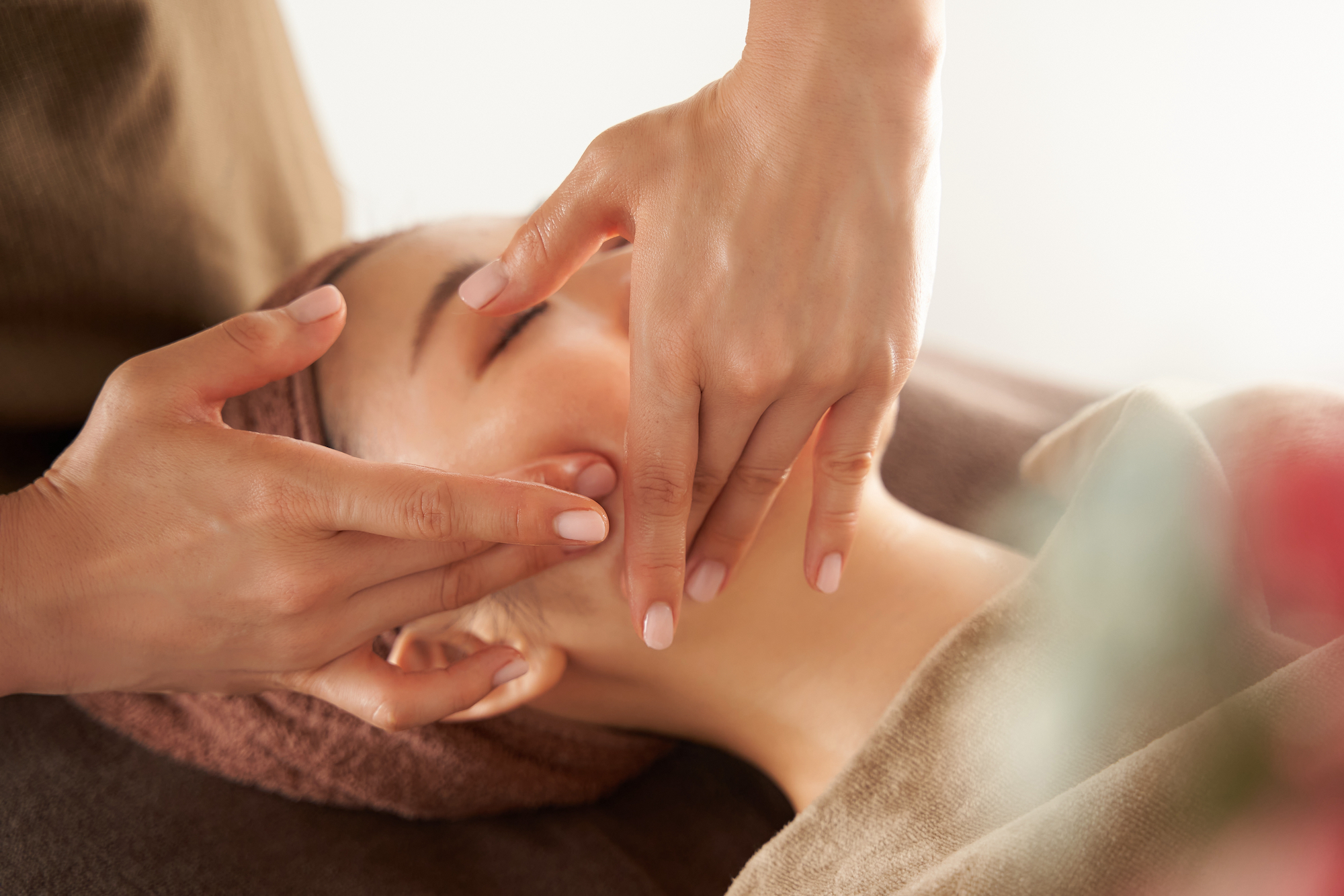 Woman getting her face massaged