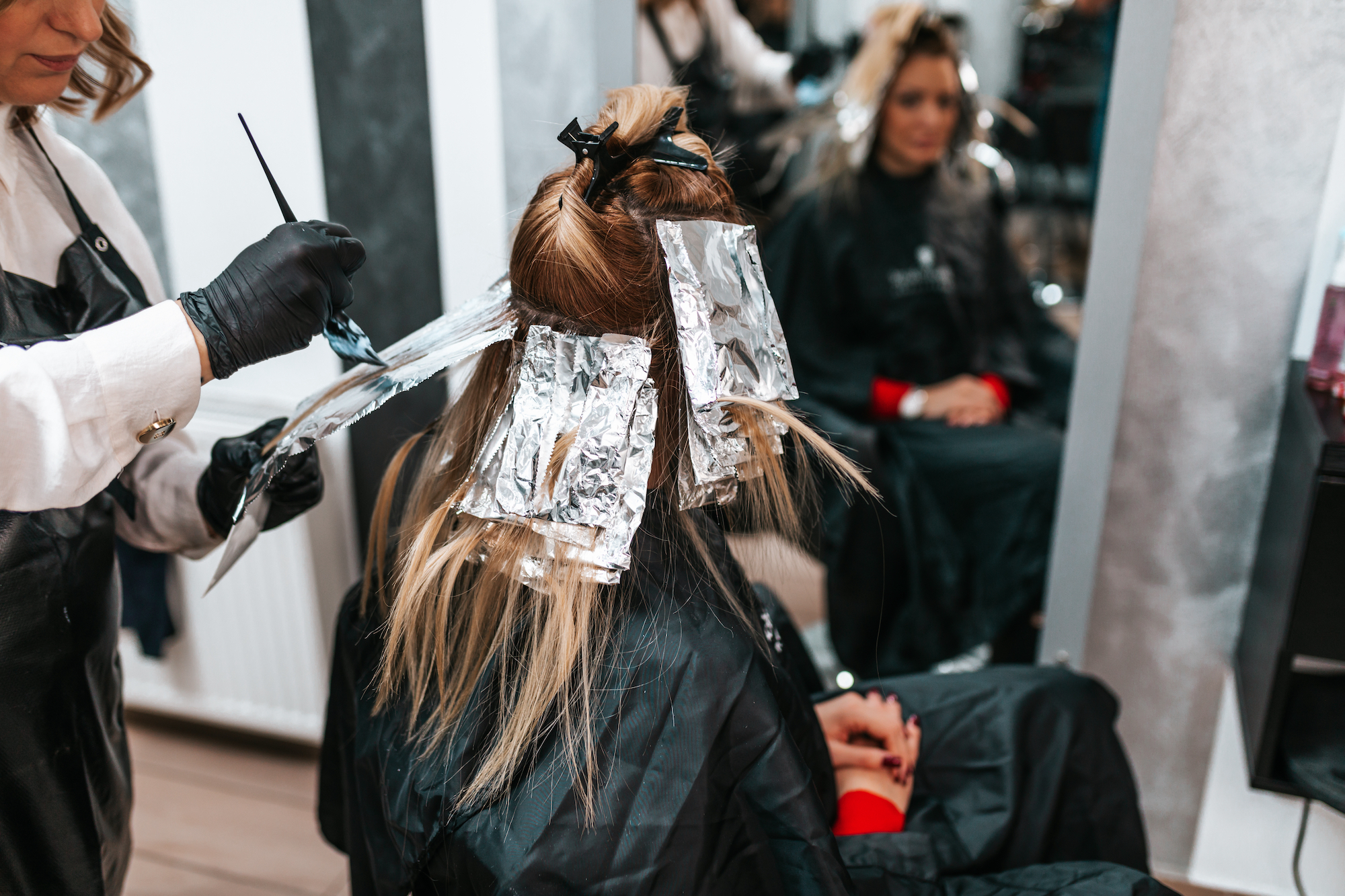 Woman getting her hair dyed